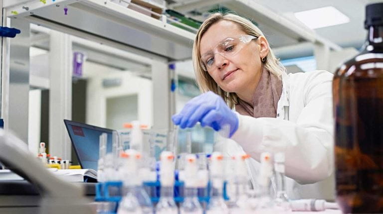 CSL employee in the lab