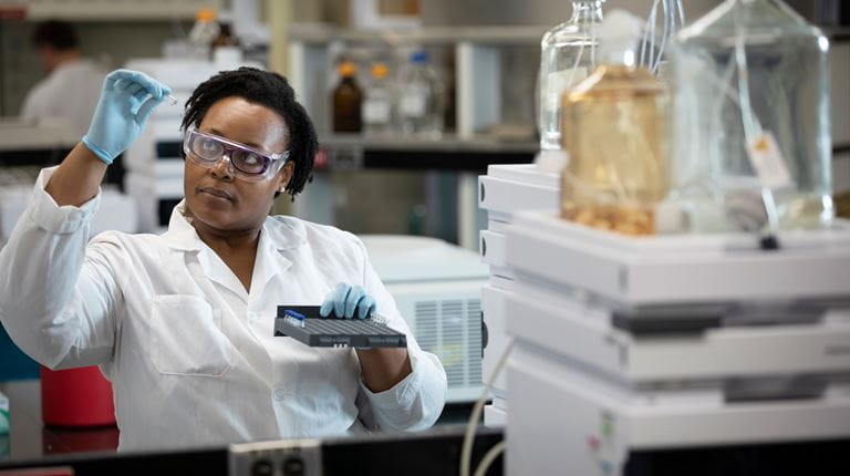 Scientist with vial