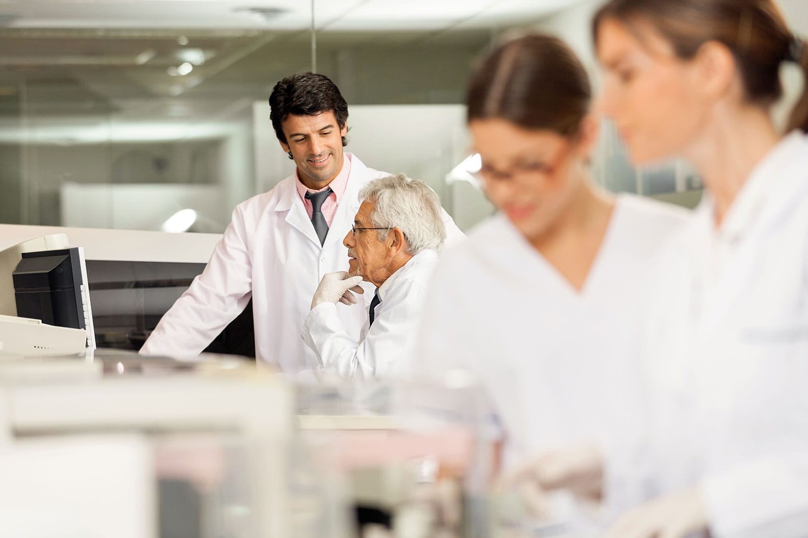 Gender and age diverse researchers in a lab