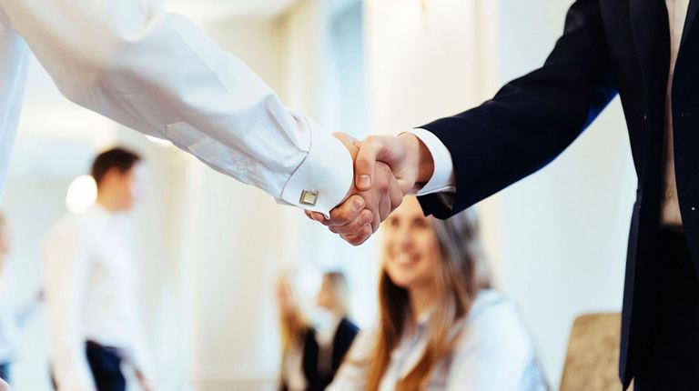 Two people shaking hands